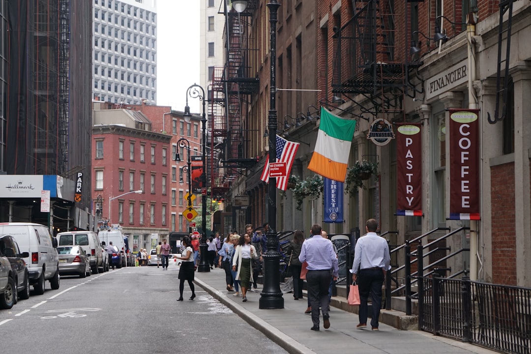 people walking beside building