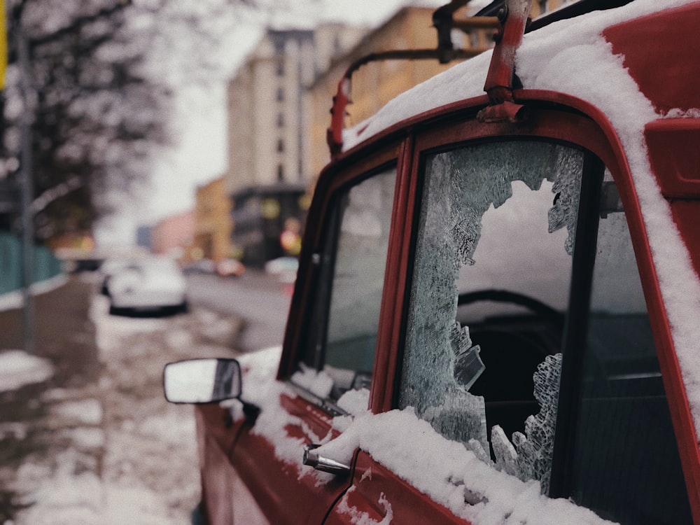 red vehicle with broken window