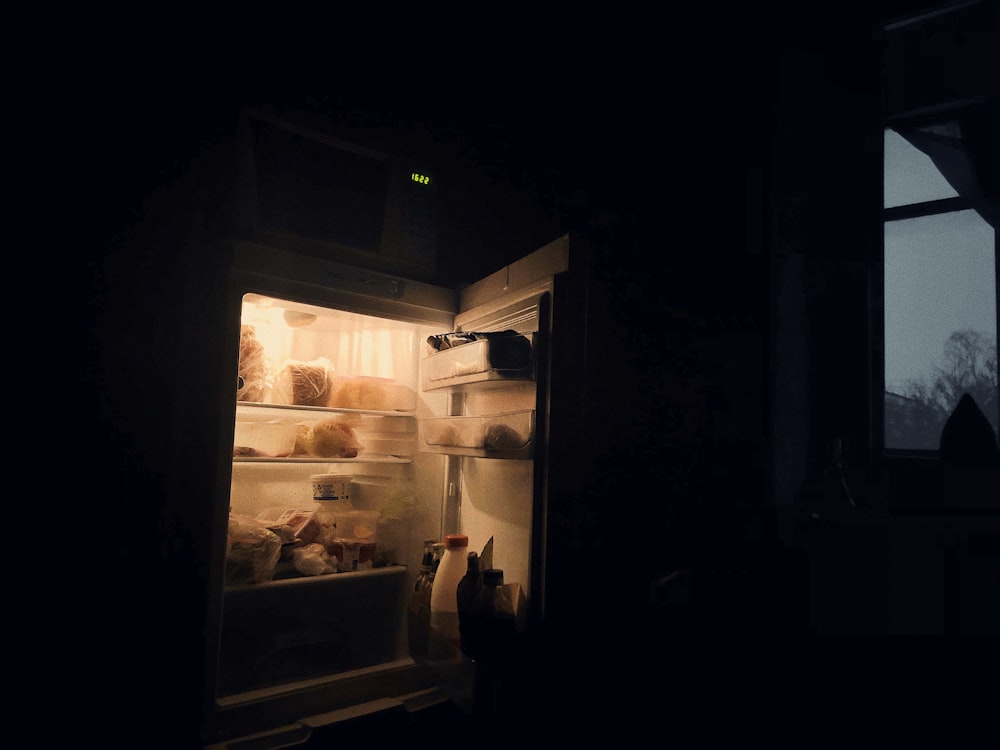 opened refrigerator inside room