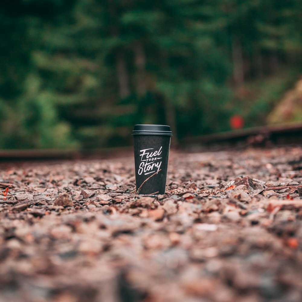 Fuel Story graphic tumbler on ground during daytime