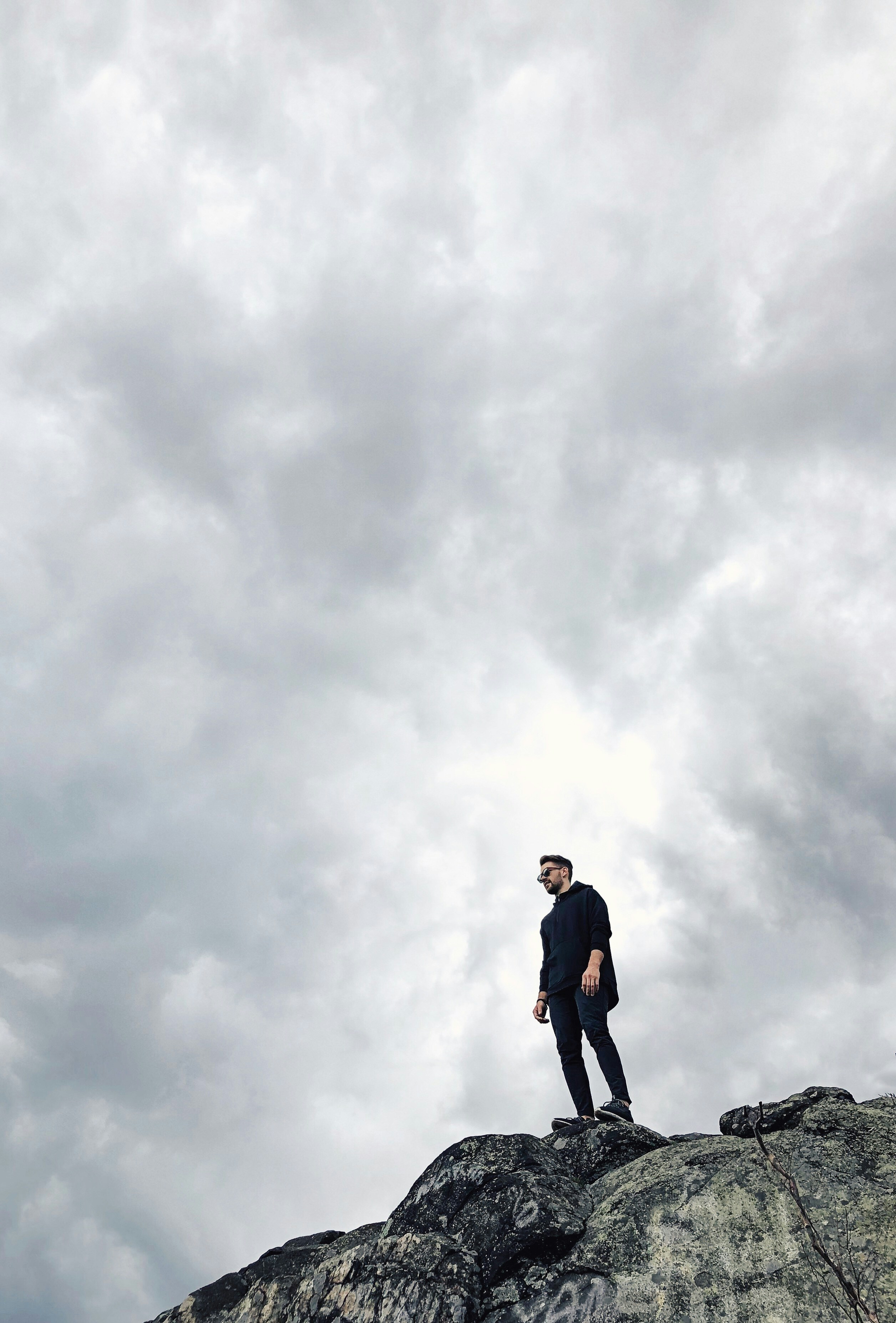 man standing on cliff