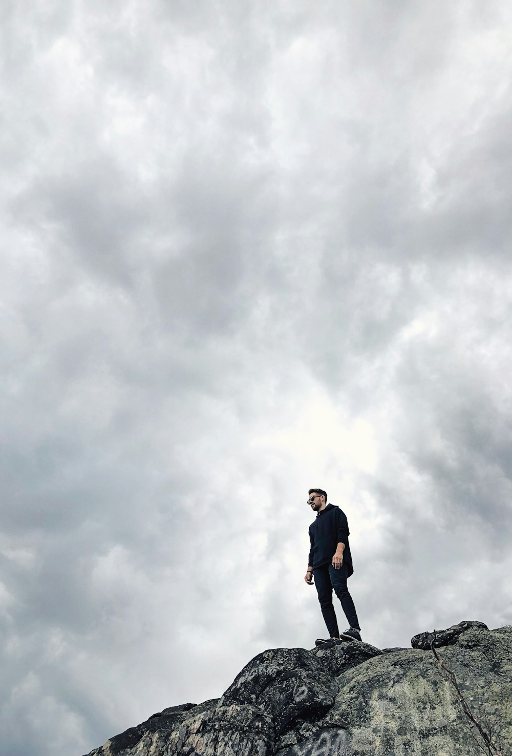 man standing on cliff