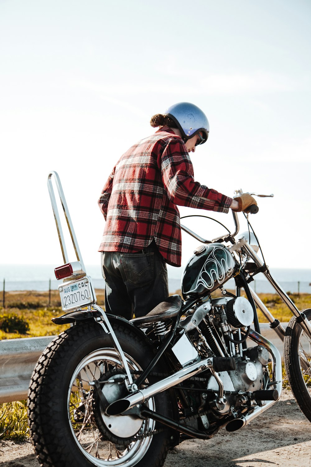 man about to ride chopper motorcycle