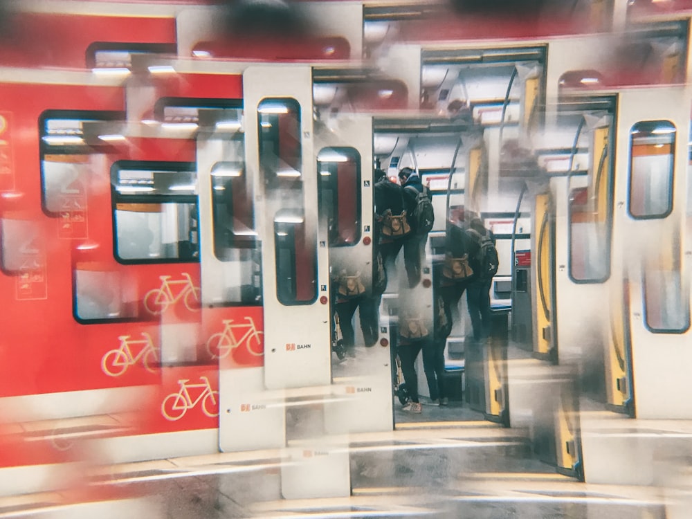 a group of people standing next to a train