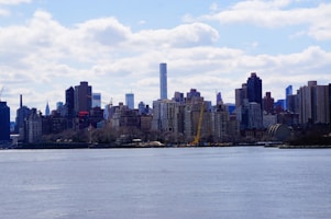 A city skyline with various real estate properties available for investment.