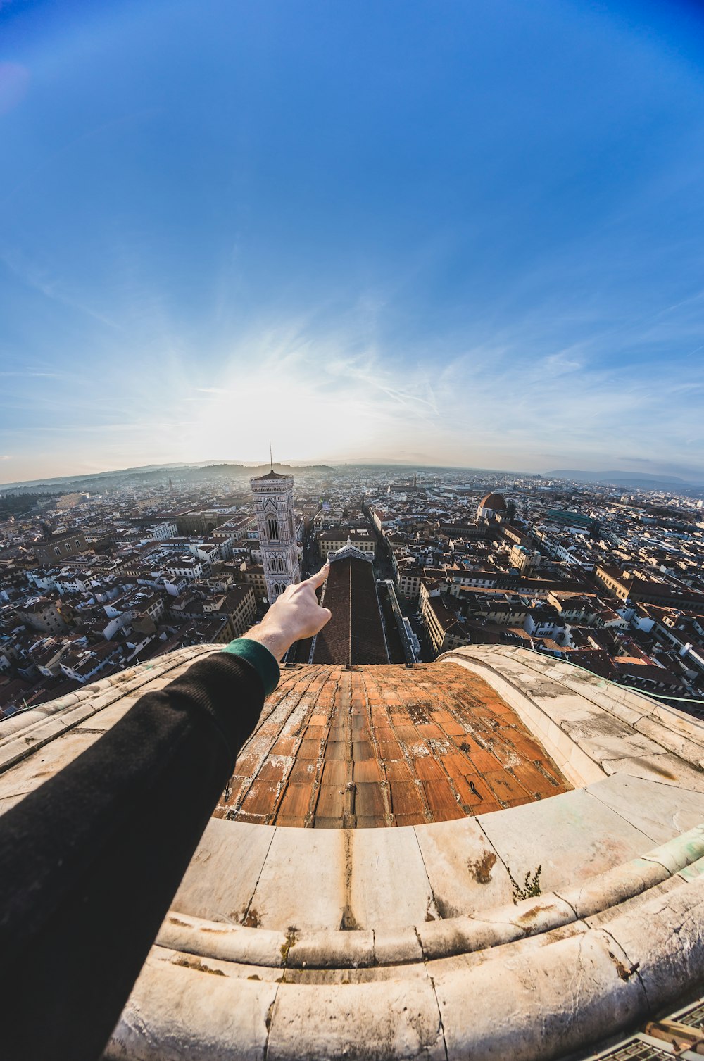 person pointing on buildings