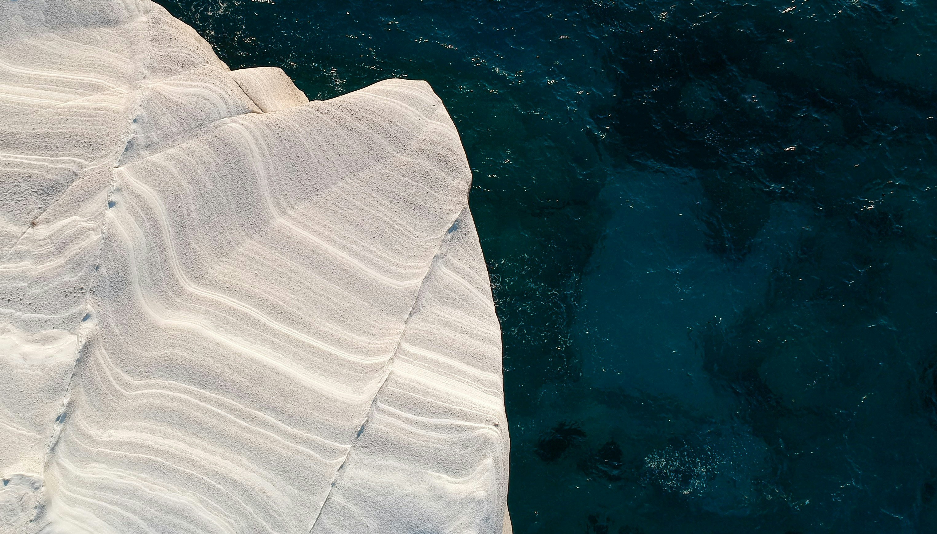 an aerial view of the water and ice
