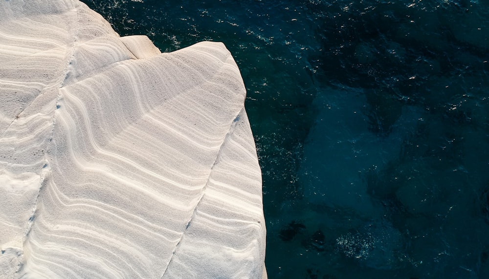 an aerial view of the water and ice