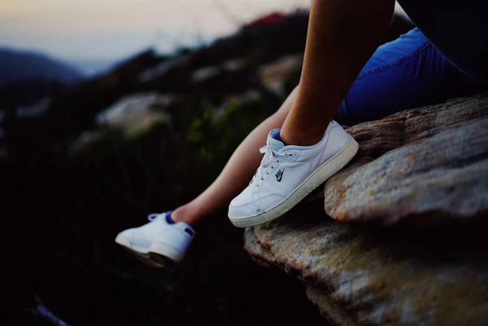 Clean white sneakers styled with a tracksuit — 80s men's outfits