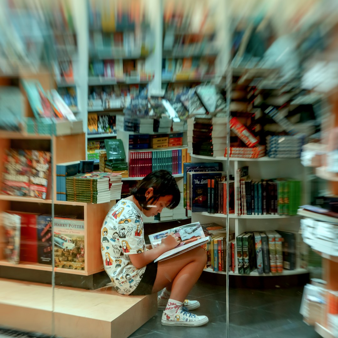 girl writing in book store