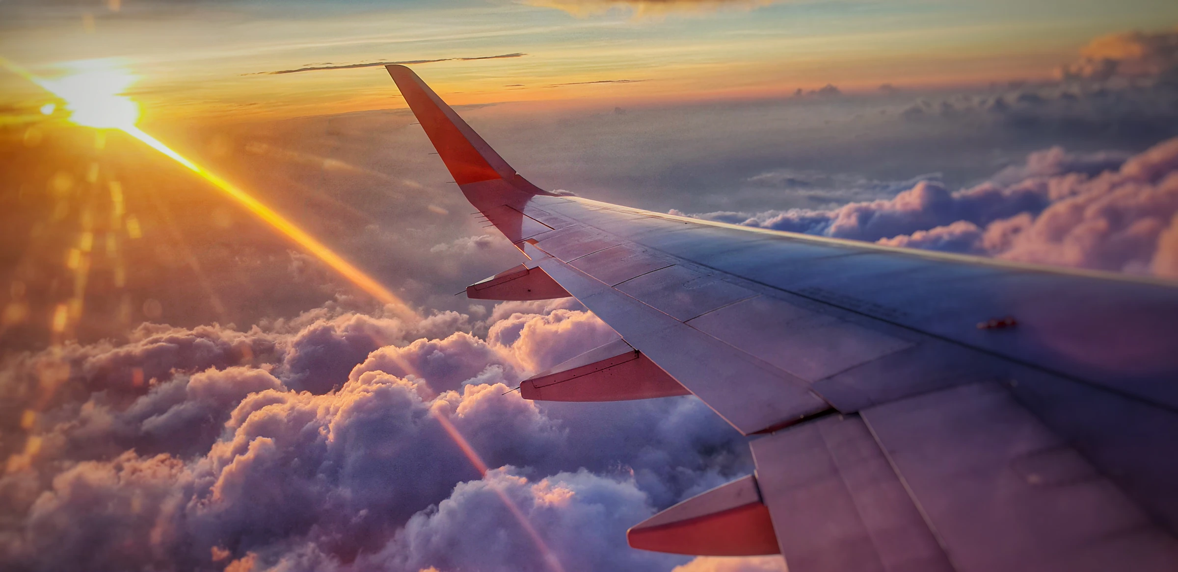 Aerial view above a sea of clouds at dawn