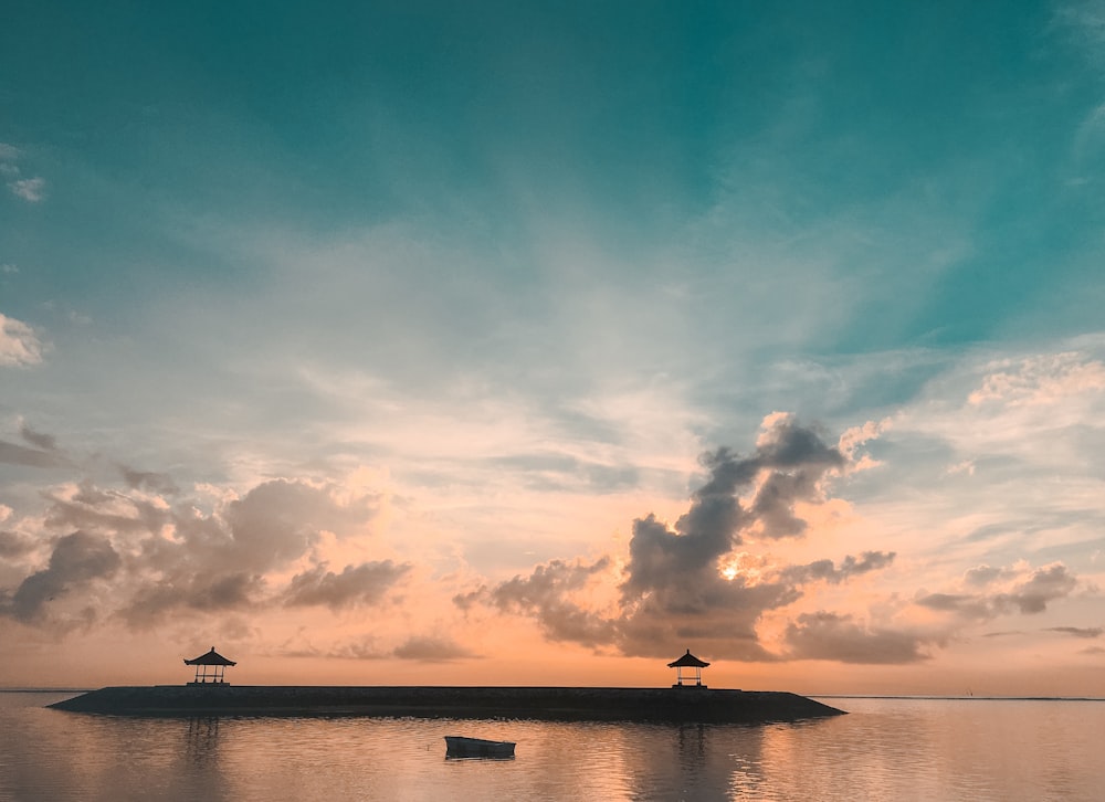 silhouette of cottages at golden hour