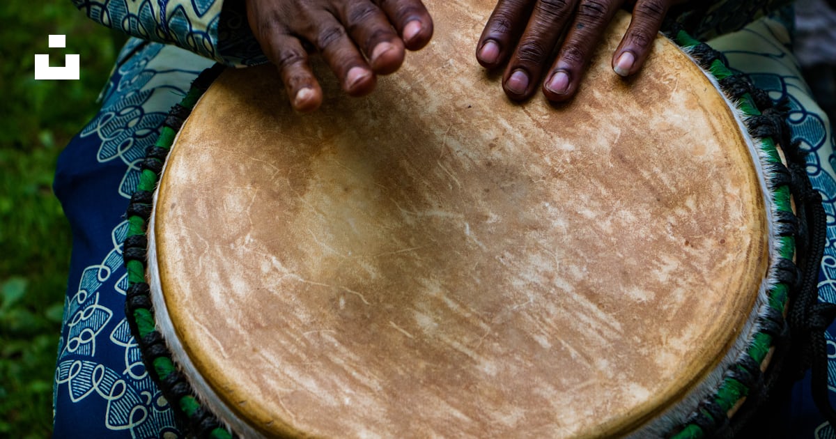 Person tapping on traditional drum instrument photo – Free Percussion ...