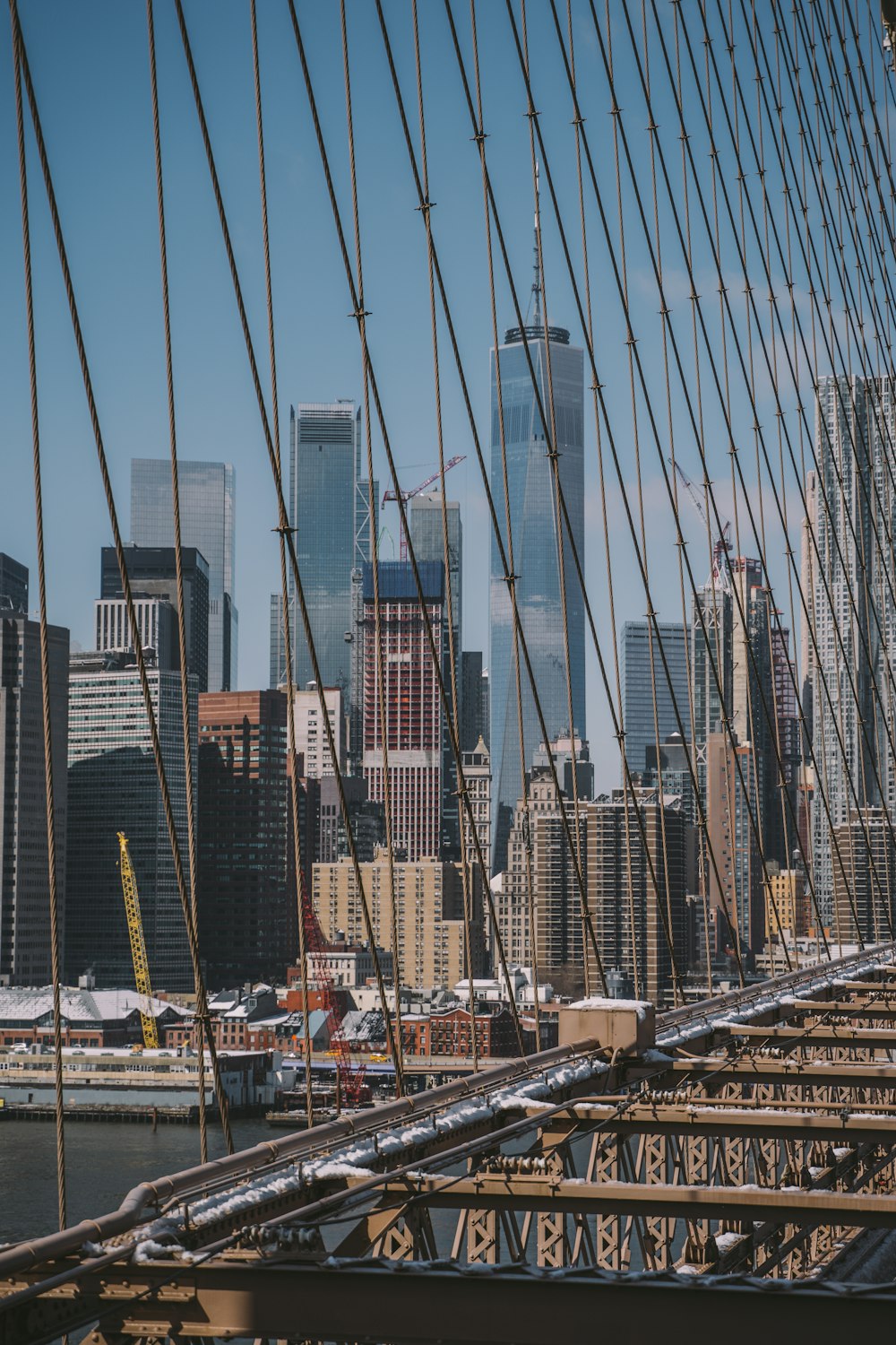 gray bridge near high rise buildings