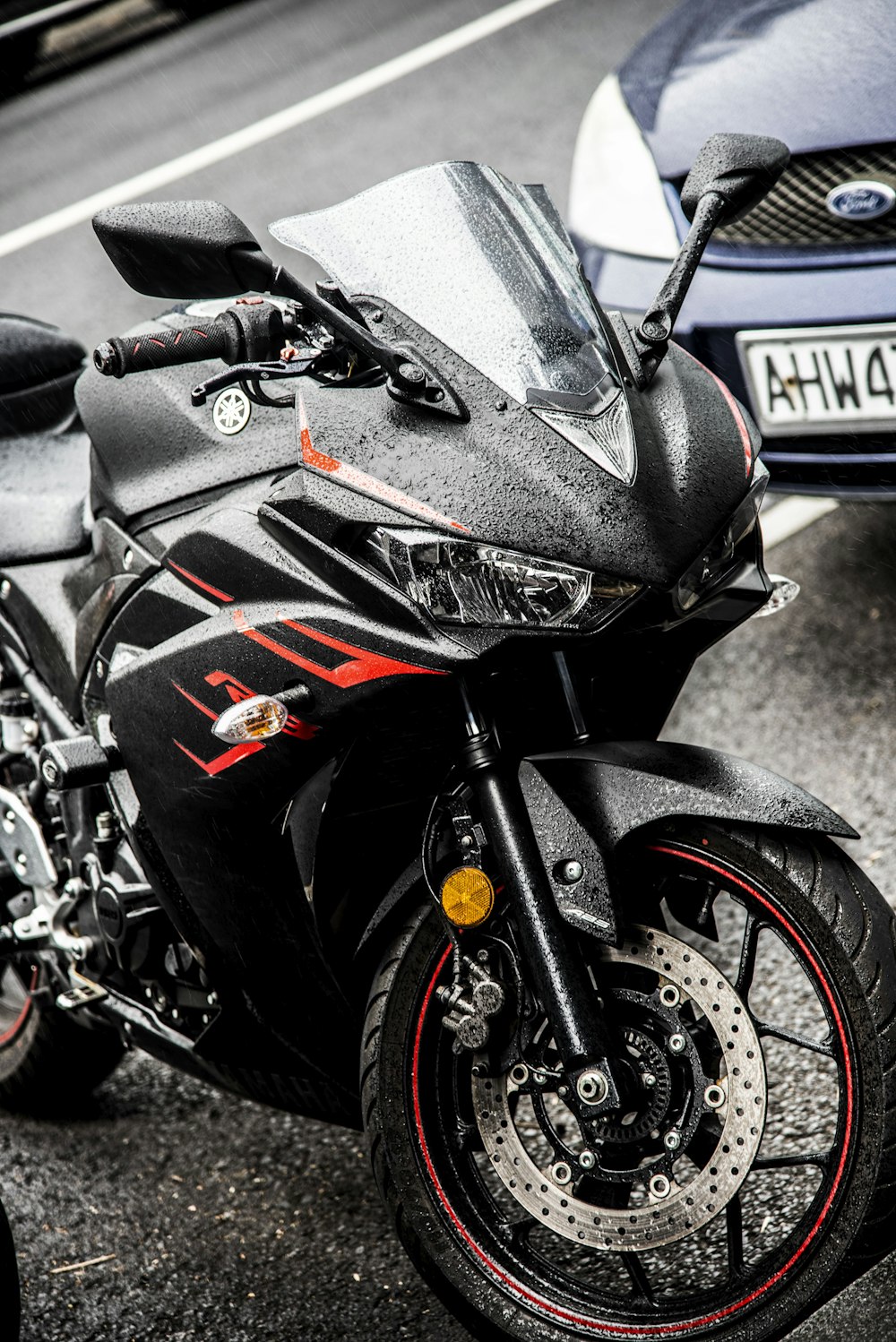 black Yamaha sports bike parked on parking lot