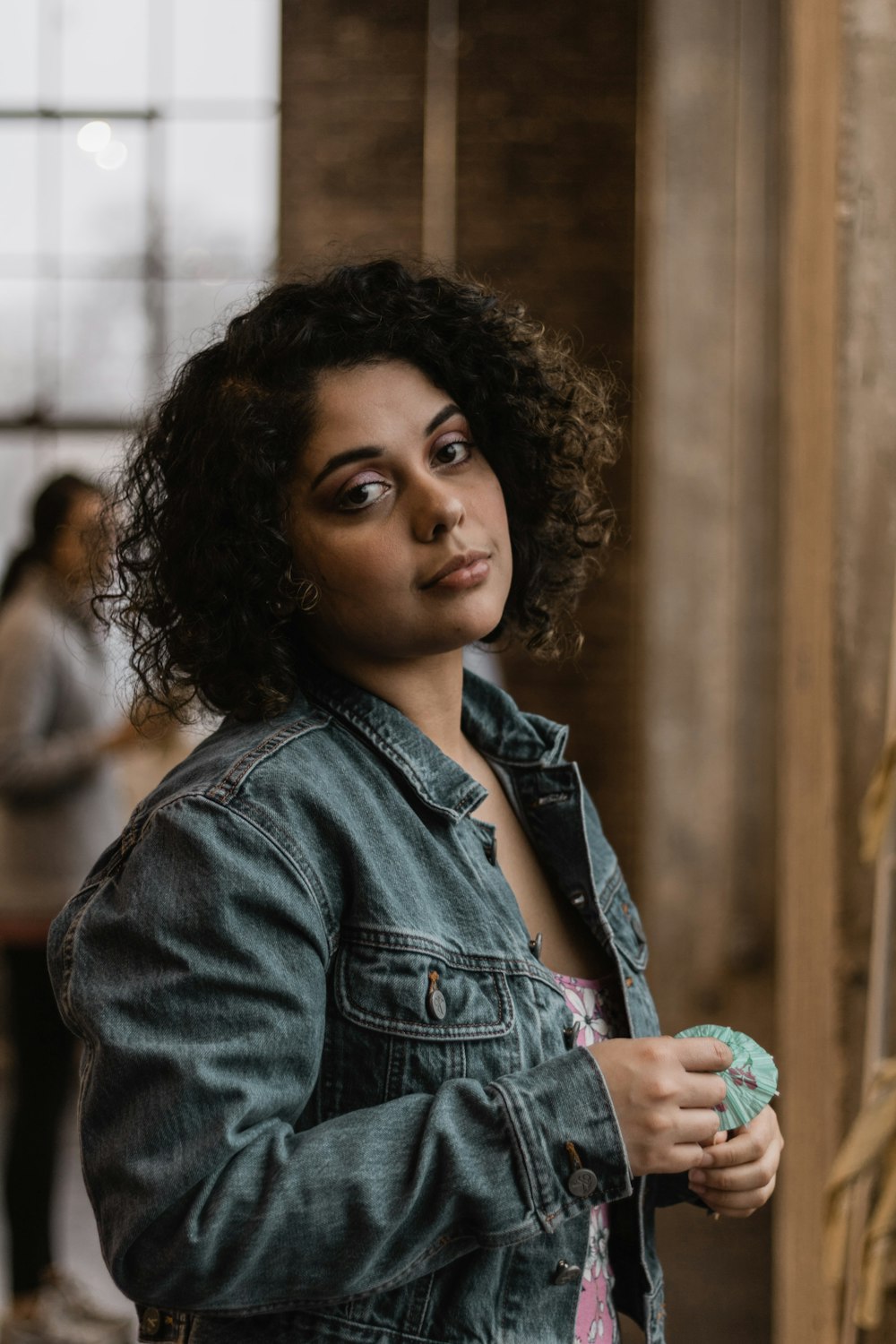 portrait photography of woman wearing blue denim jacket