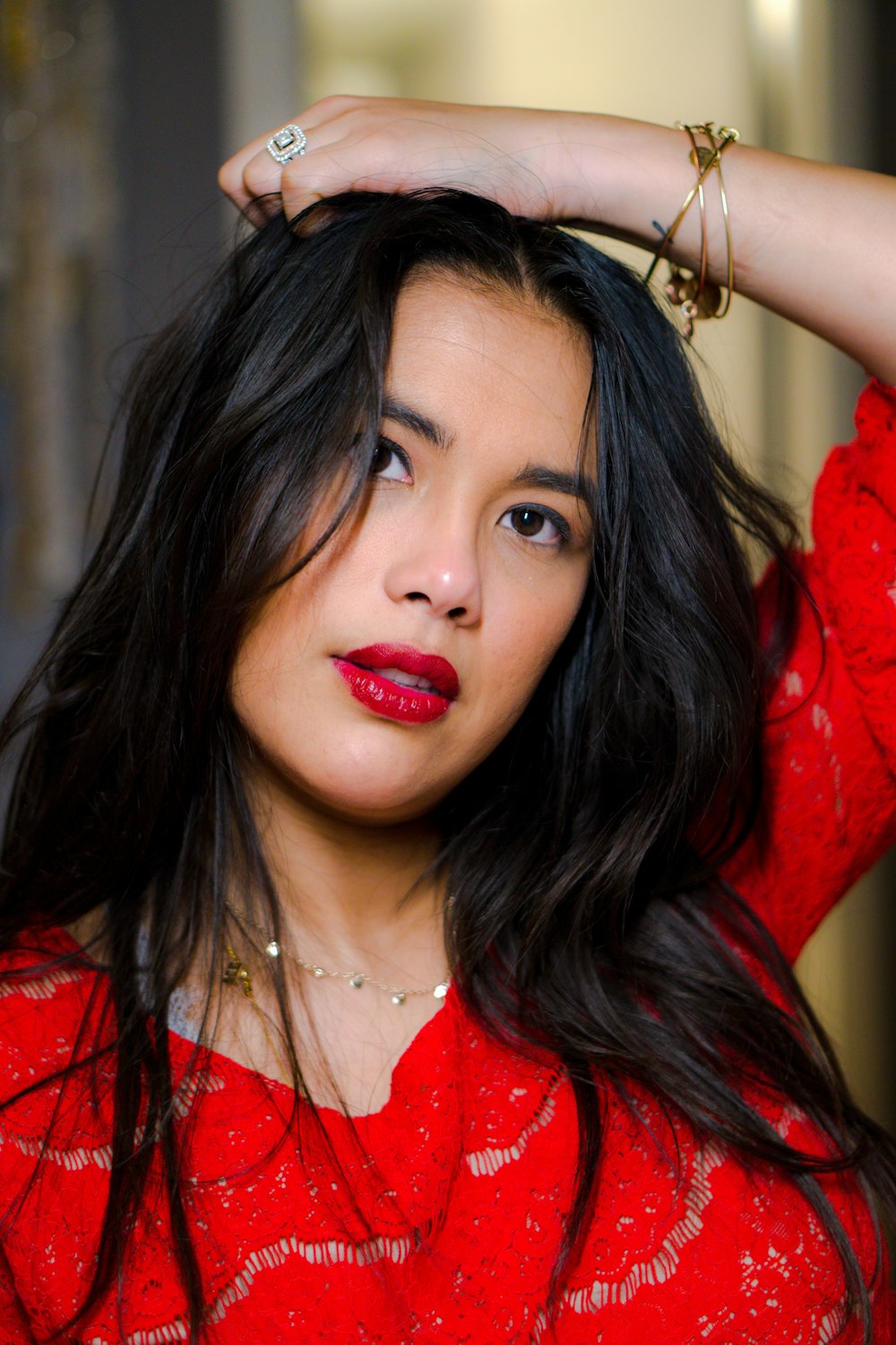 portrait photography of woman wearing red lace shirt