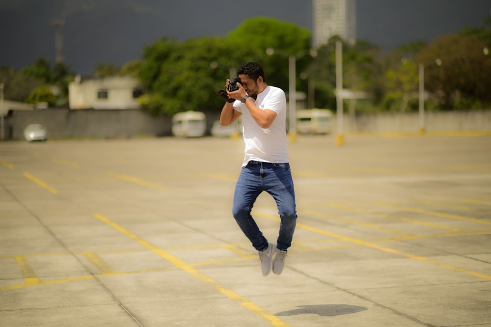 man taking photo while on air