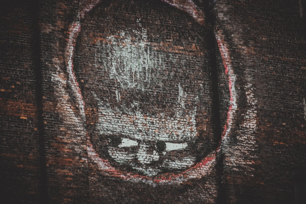 a close up of a picture of a cat on a wall