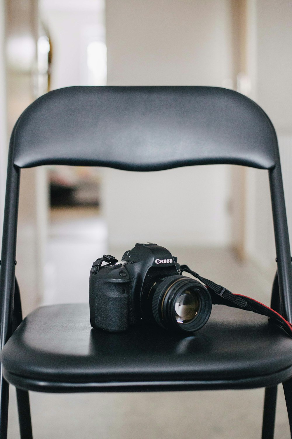 black DSLR camera on the chair
