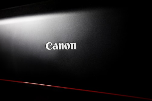 a black laptop with the word canon on it