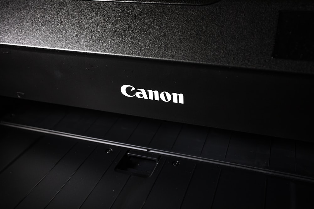 a canon printer with the word canon on it