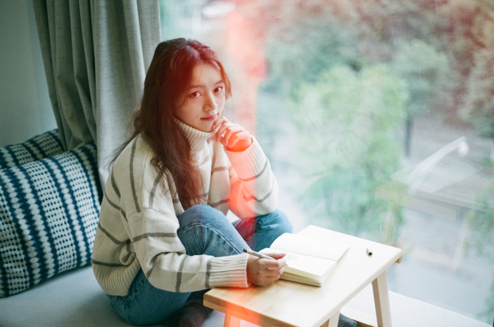 woman wearing white stripe sweater