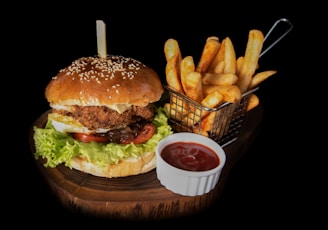 hamburger beside fries and ketchup