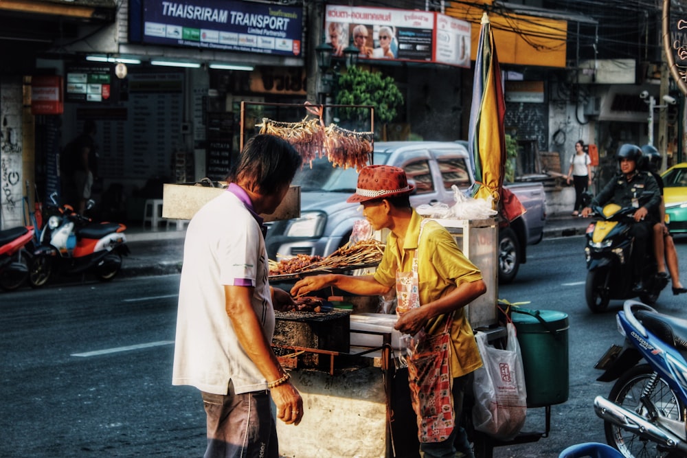 man cooking street food