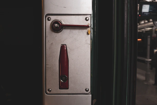 Close-up of a secure access control panel mounted on a dark industrial wall.