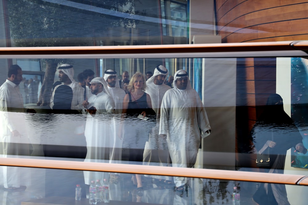 a group of people standing in front of a building