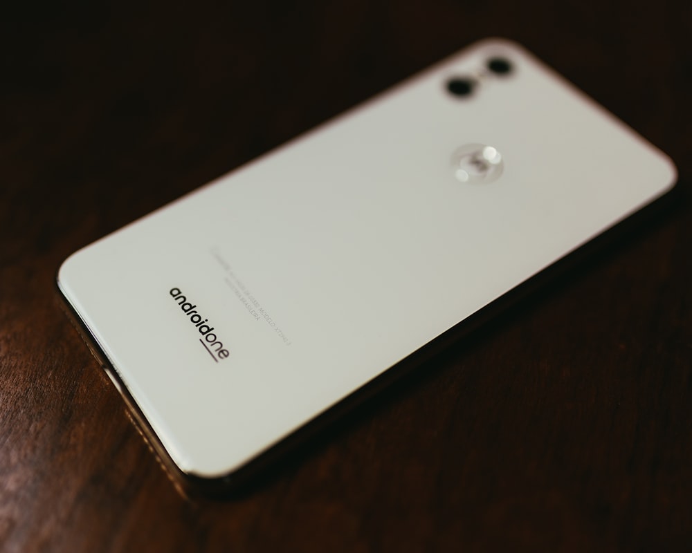 white Android One smartphone on table