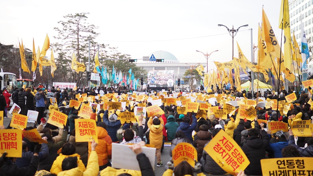 people doing rally on road during daytime