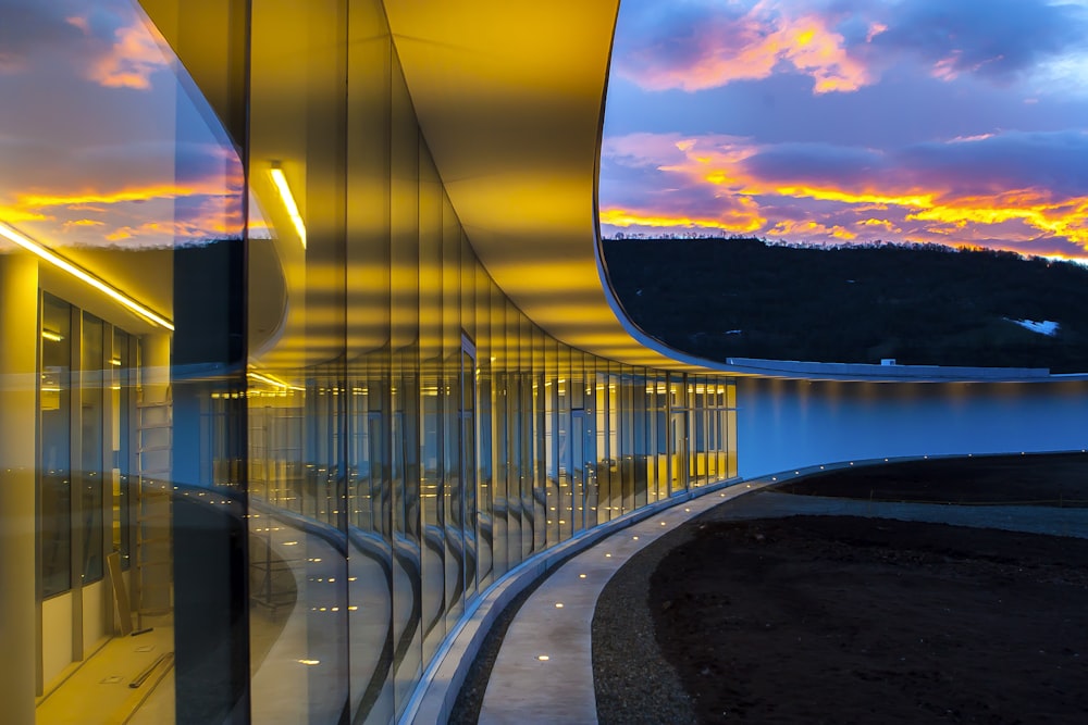 clear glass wall building under blue sky with clouds