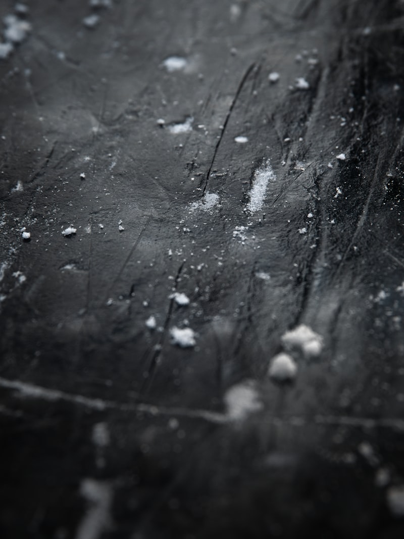 Flour dusting on a dark table showing texture