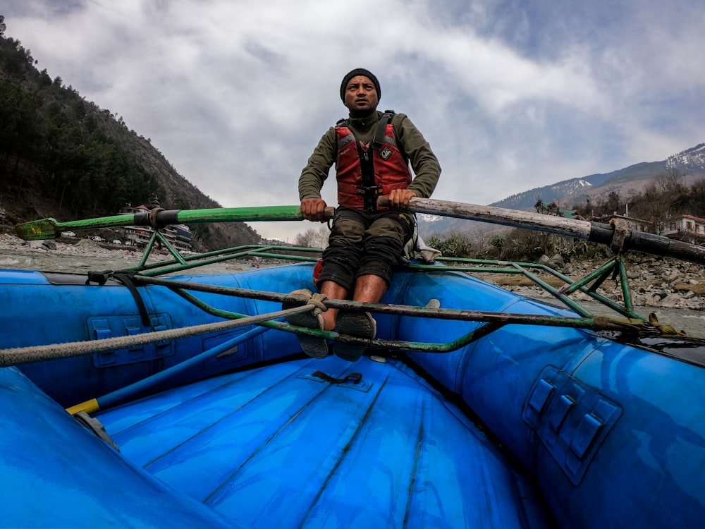 man riding boat outdoors