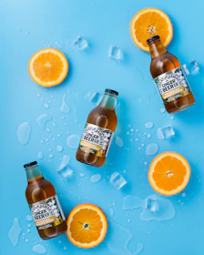 three Ginger Beer bottles