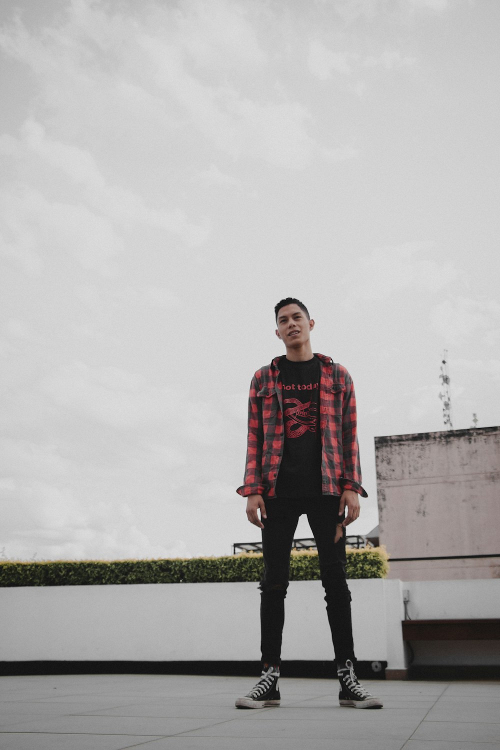 man wearing red and black plaid sports shirt