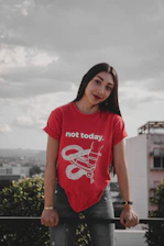 woman wearing red crew-neck with not today printed text