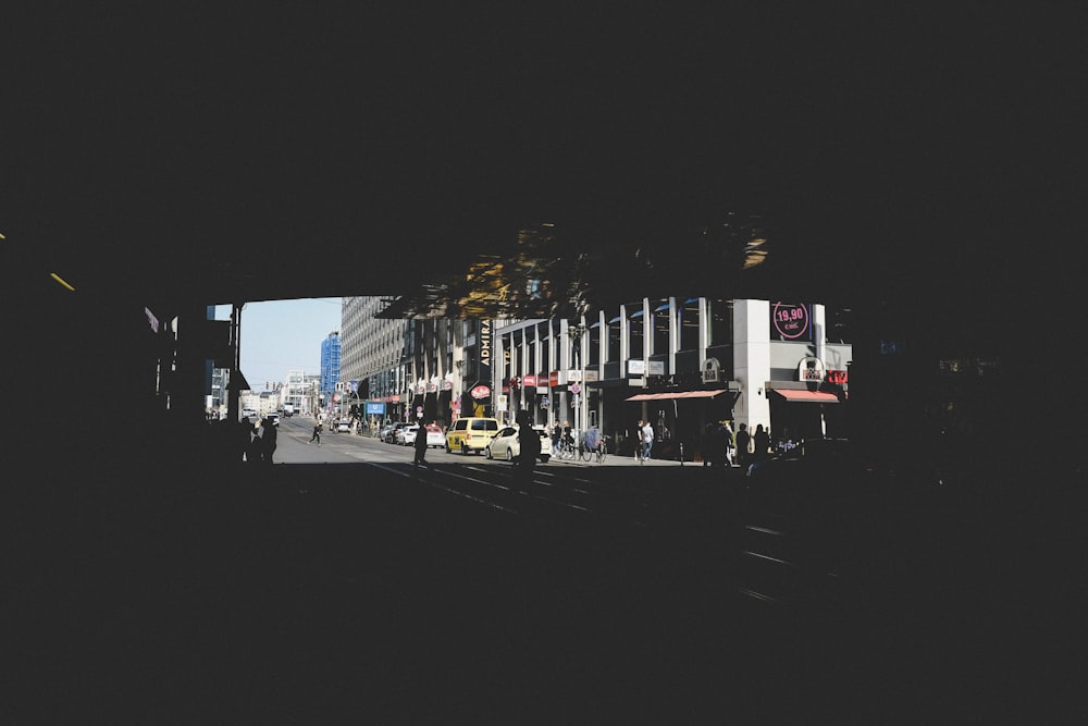 vehicle parked beside buildings