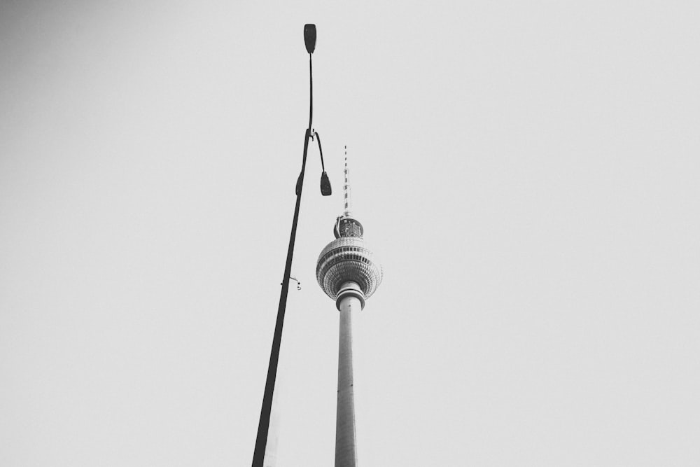 street lamp beside white tower