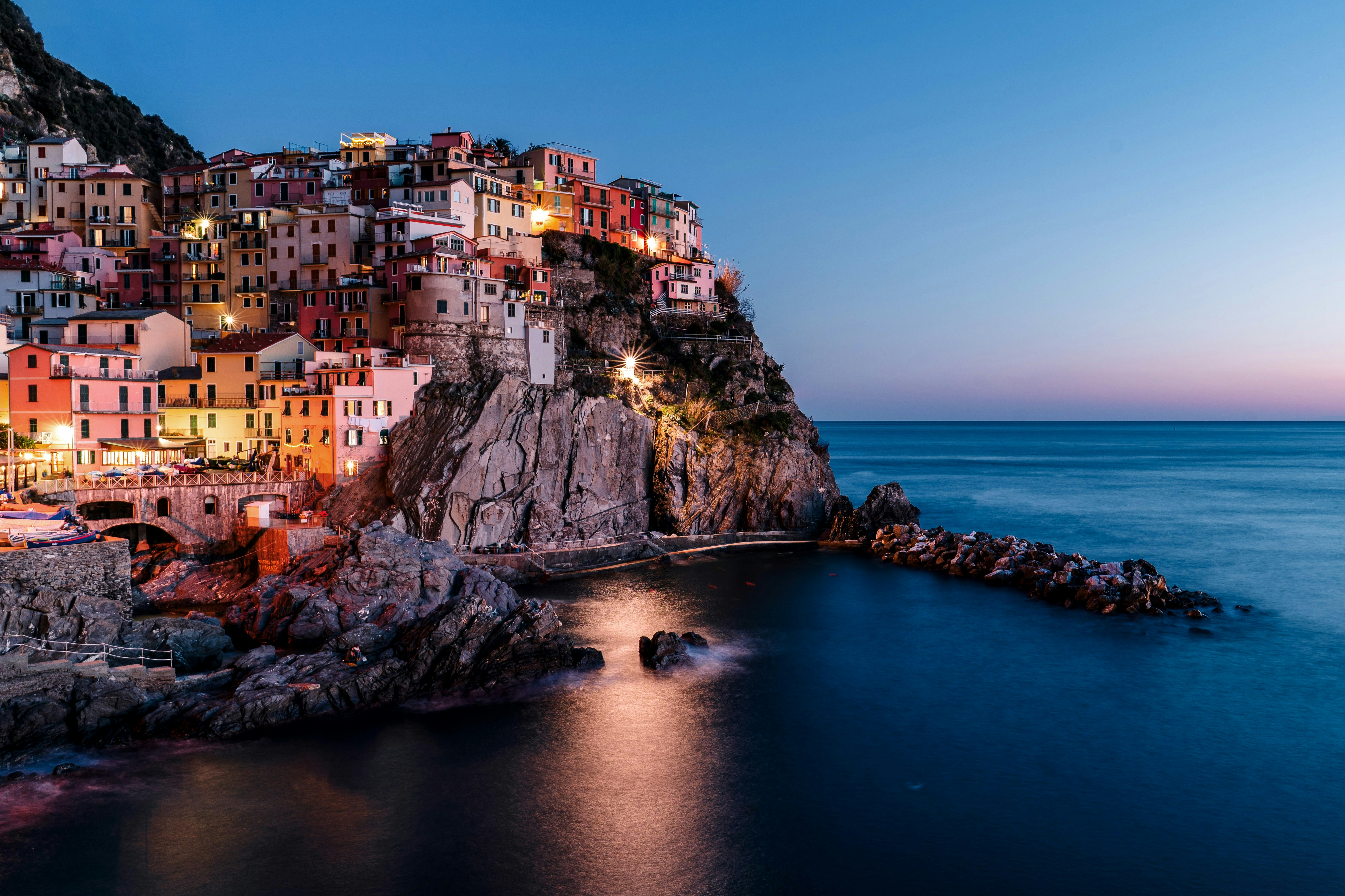 lighted houses near ocean