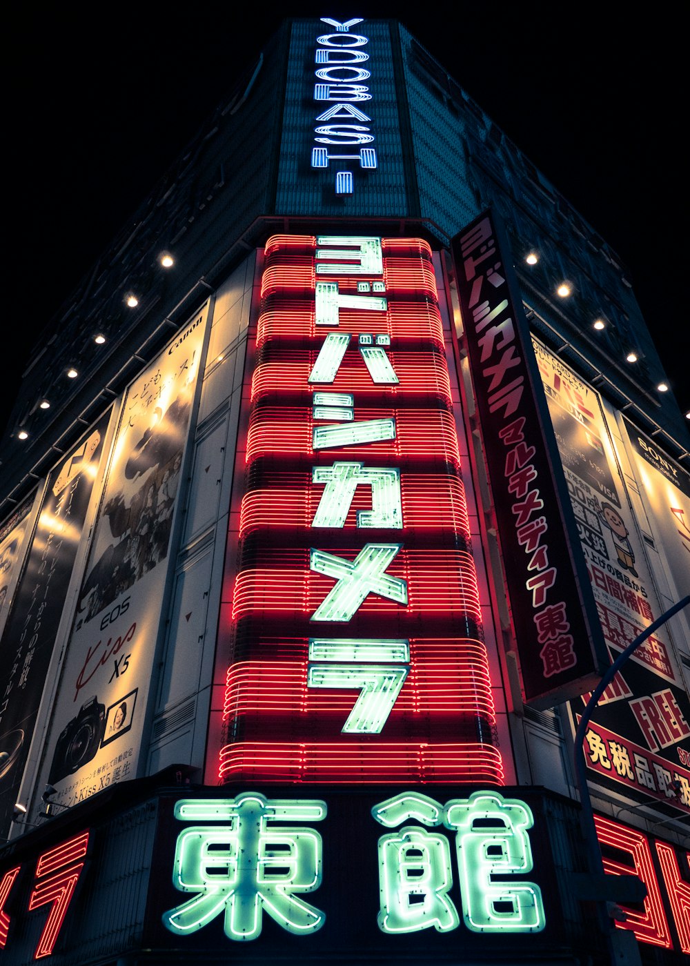 red and black concrete building during night time