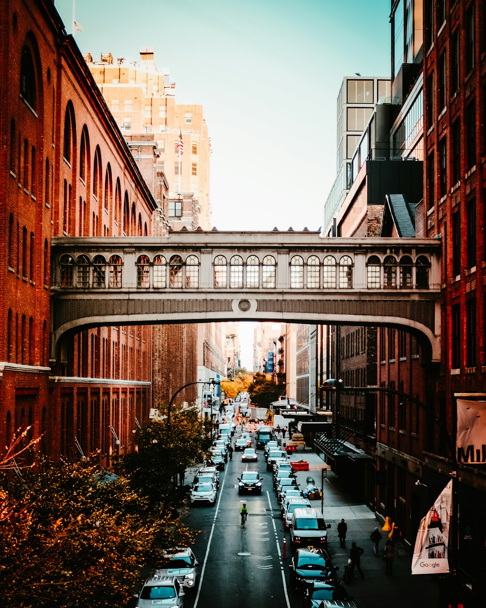 vehicles passing by road under a bridge