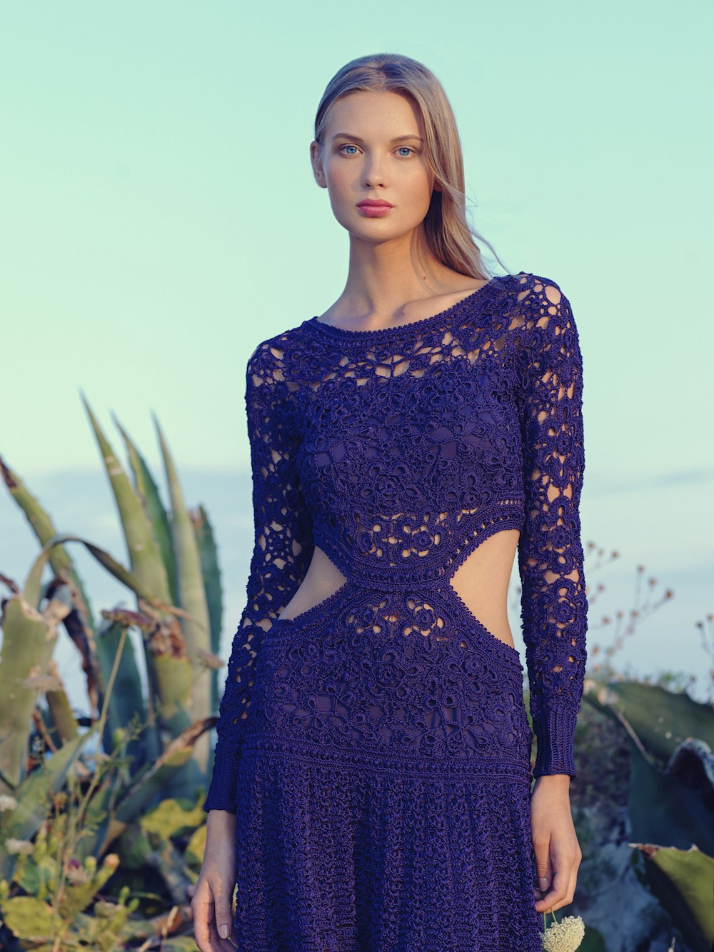 woman in purple lace knitted long-sleeved dress during daytime