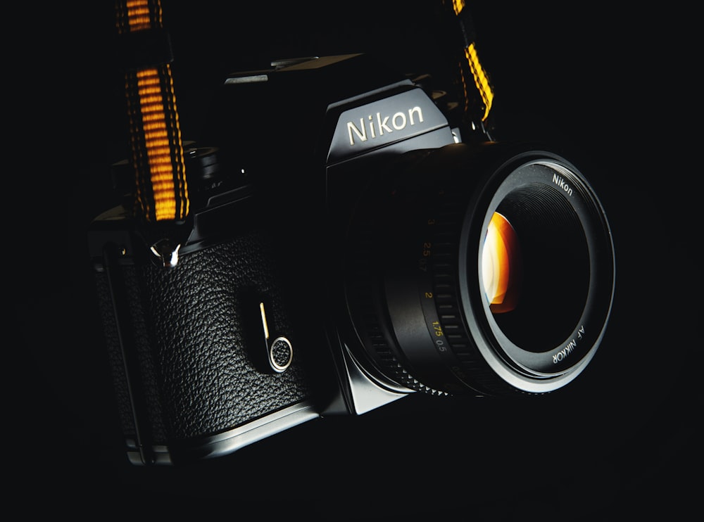 black Nikon DSLR camera