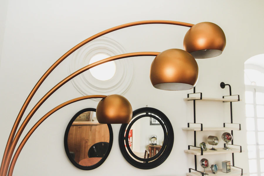 Brass three-light arc floor lamp in a living room
