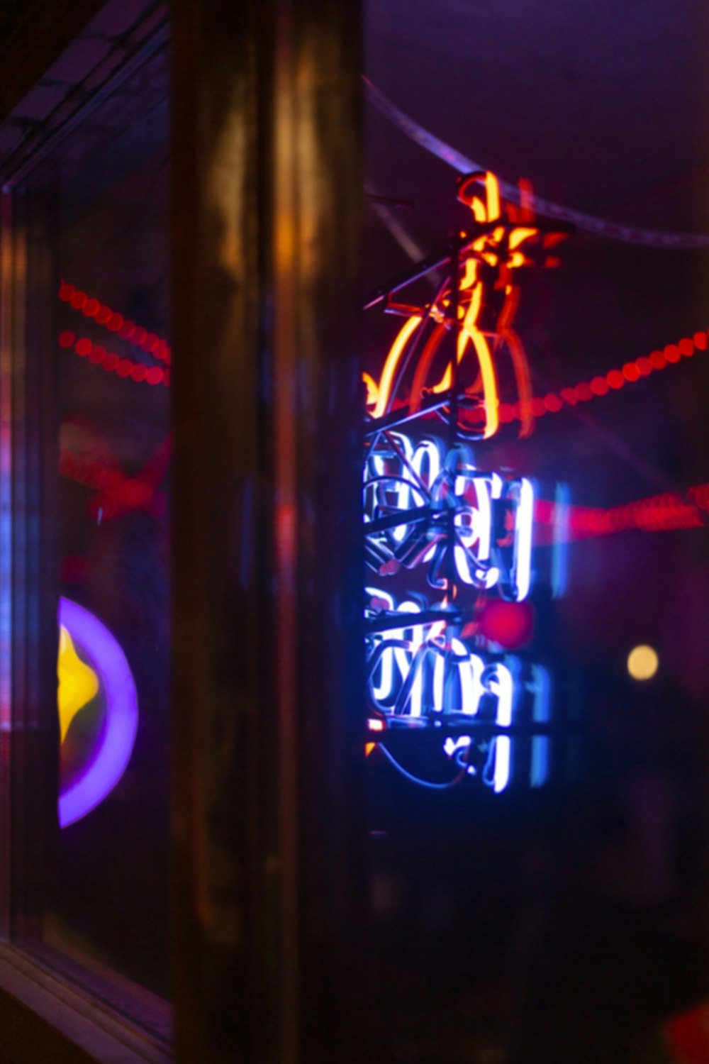 blue, red, and orange neon signage turned-on