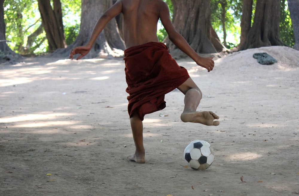 man playing with soccer ball