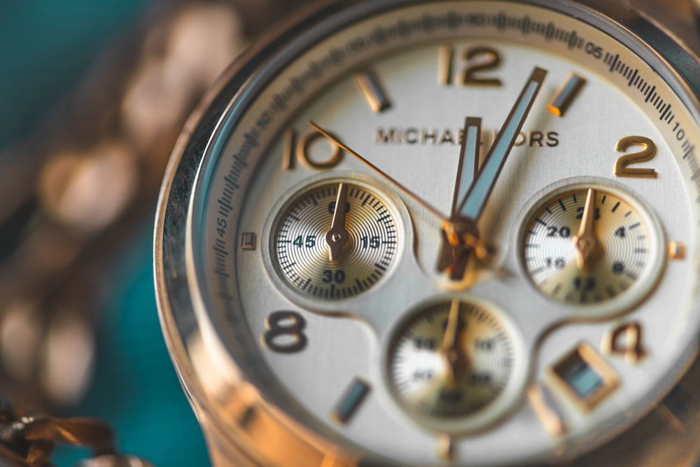 round gold-colored Michael Kors chronograph watch photo – Free Grey Image  on Unsplash